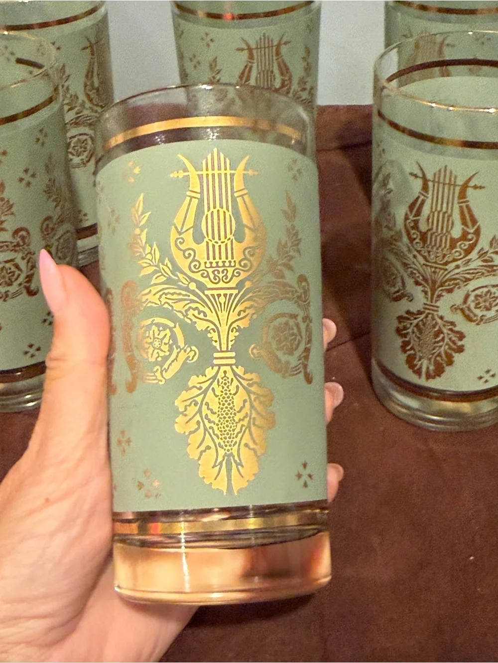 Set of 6 glasses vintage green and gold design. Holds 8 ounces